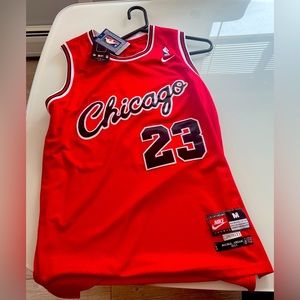 Brand new men’s Nike Michael Jordan Chicago Bulls red jersey. Size mens medium